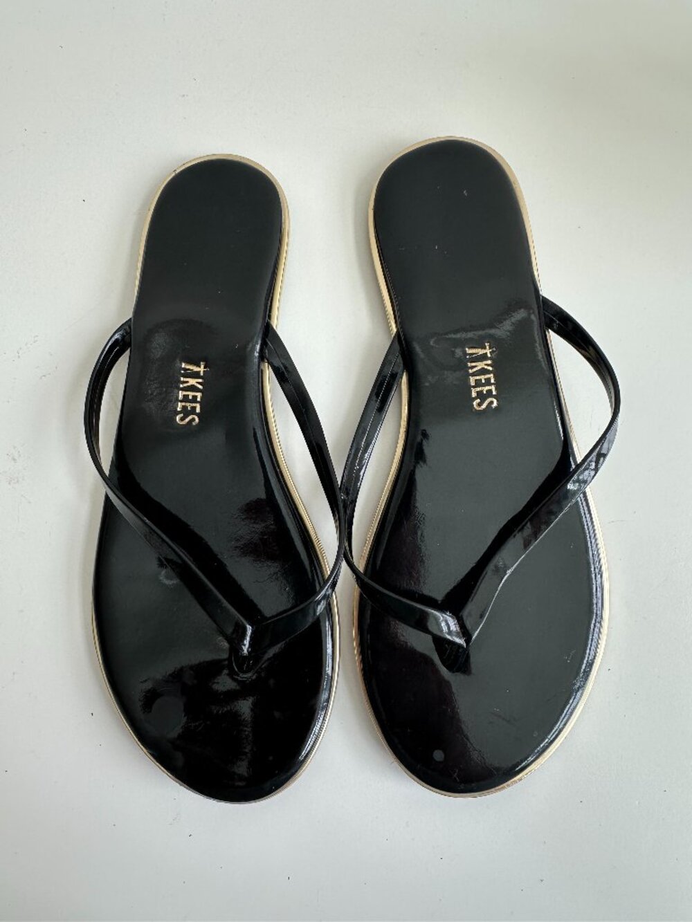TKEES Patent Black Flip Flops size 6; New with Defects